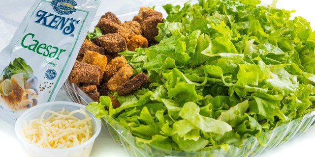 Caesar salad with dressing and croutons
